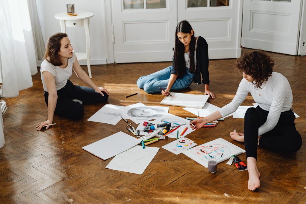 Three women painting